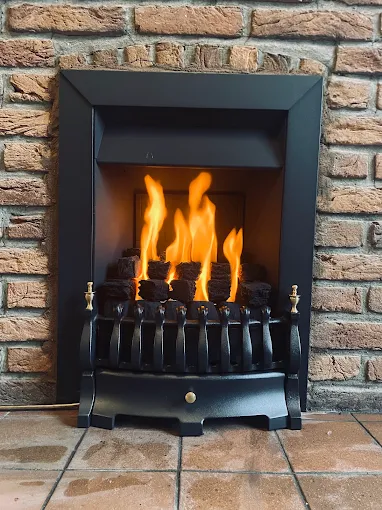 Gas fire fitted and commissioned in a brick fireplace